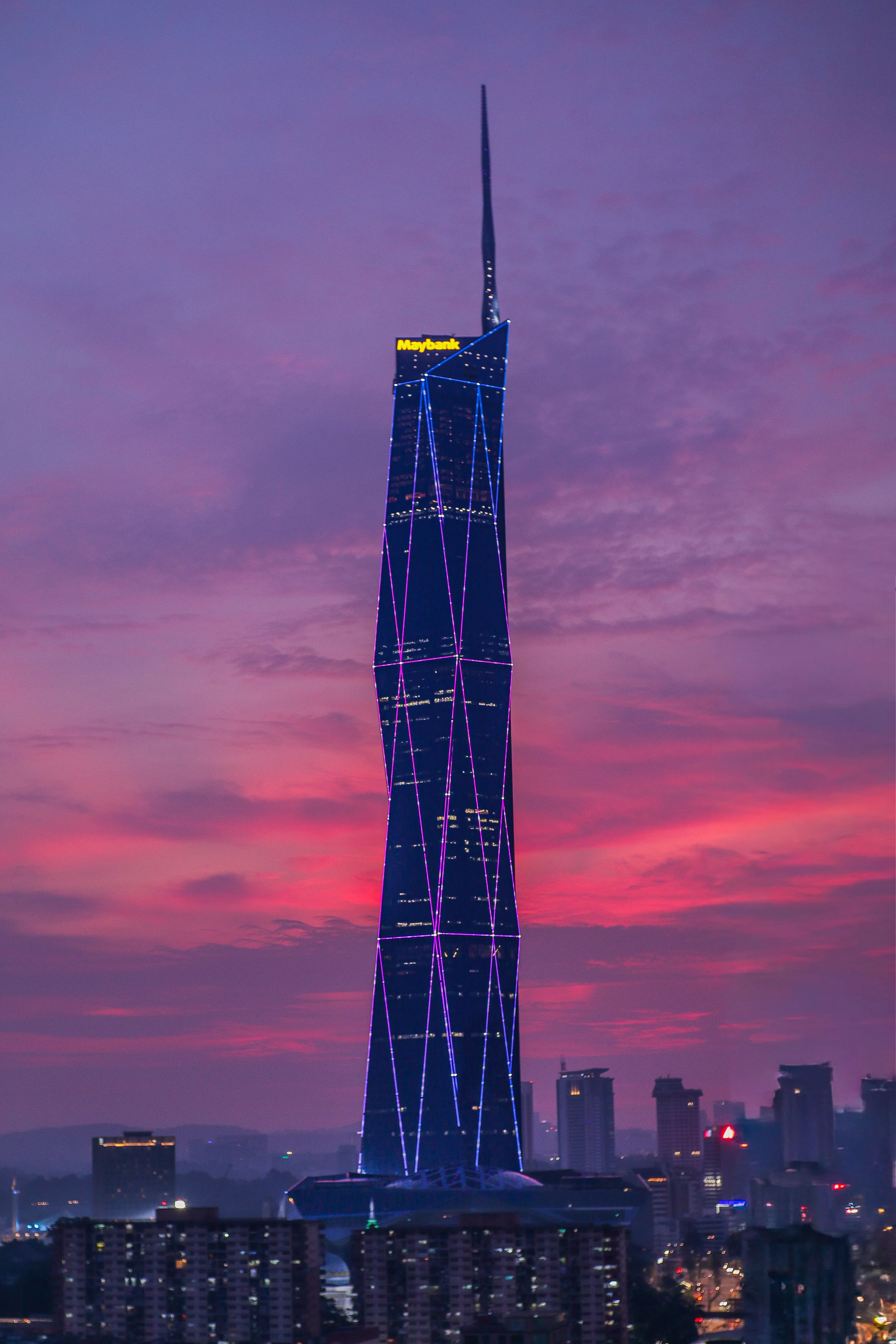 Merdeka 118 beneath a dramatic pink evening sky